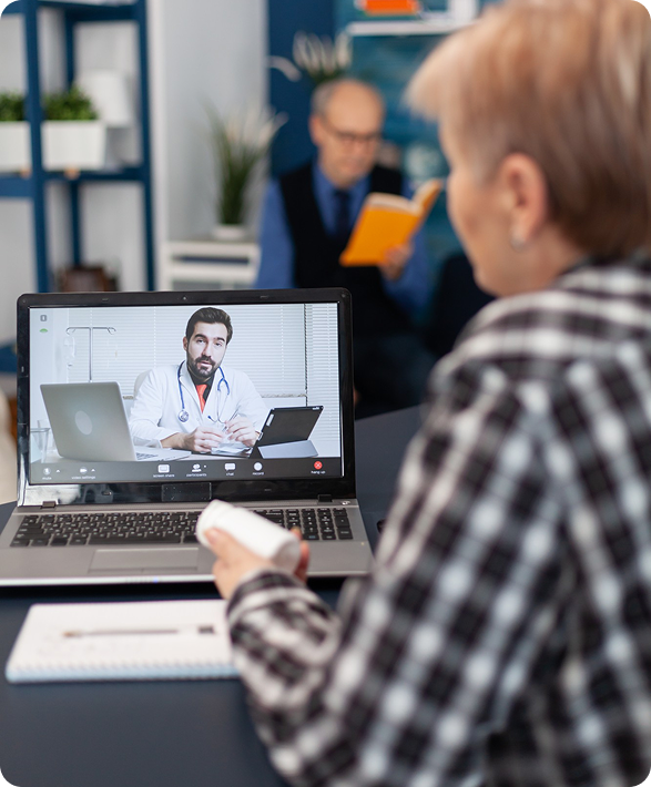 Person with blanket using laptop